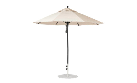 Introducing the Essential Fiberglass Umbrella by Ledge Lounger, featuring a 9 octagon beige canopy from marine-grade fabrics. It includes a central metal pole on a sturdy, flat circular base.