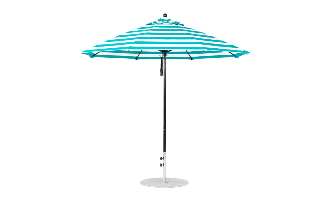 The Ledge Lounger Essential Fiberglass Umbrella - 9 Octagon Pulley features a teal and white striped design with marine-grade fabrics for durability. It stands on a metal pole with an umbrella base, open and shown from the side against a plain white background.