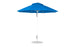 A blue Essential Fiberglass Umbrella by Ledge Lounger, featuring a 9 octagon canopy with a vented top, rests on a white pole and sturdy round base. It includes a manual crank handle for easy operation.