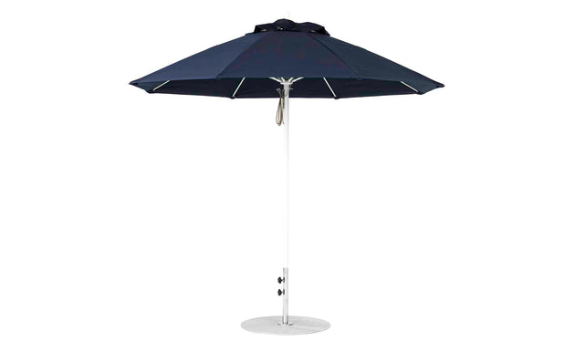 The Ledge Lounger Essential Fiberglass Umbrella boasts a 9’ octagon canopy made with marine-grade fabrics and features a silver pole atop a sturdy round base, ready for outdoor use.