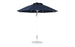 The Ledge Lounger Essential Fiberglass Umbrella boasts a 9’ octagon canopy made with marine-grade fabrics and features a silver pole atop a sturdy round base, ready for outdoor use.
