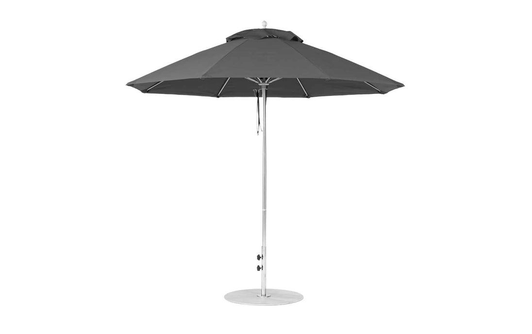 The Ledge Lounger Essential Fiberglass Umbrella features a black 9 octagon canopy with sleek aluminum pole and round sturdy base, crafted using marine-grade fabrics. Perfect for outdoor shade, the umbrella is fully open on a plain white background.