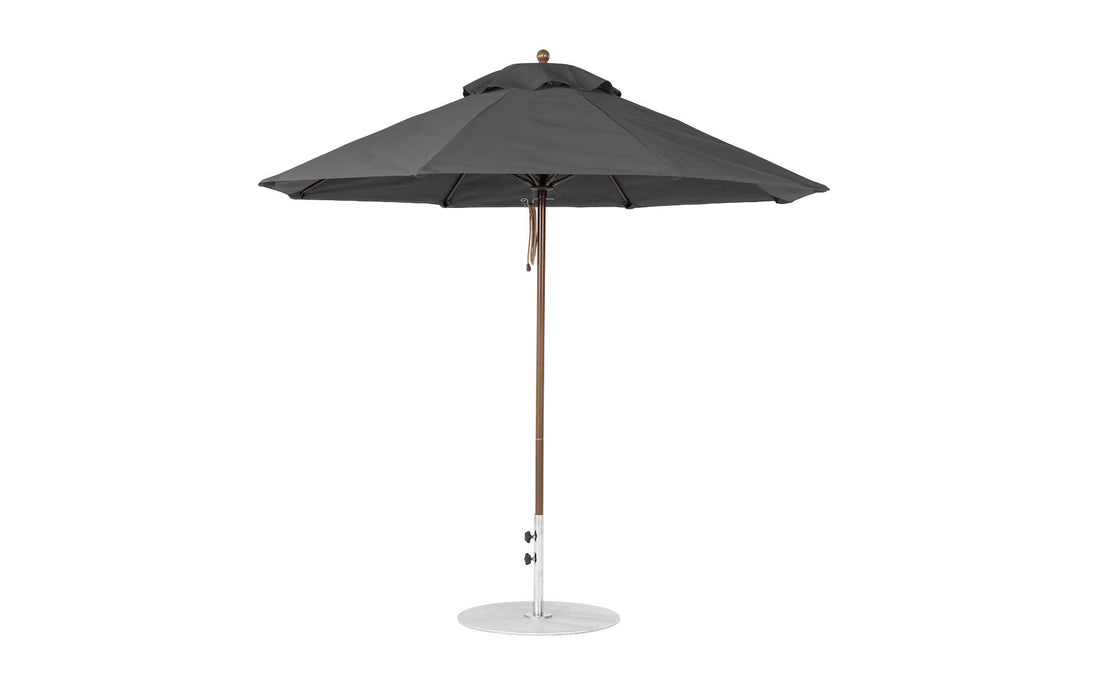 The Ledge Lounger Essential Fiberglass Umbrella, in dark gray with a wooden pole and round metal base, features marine-grade fabrics. When fully open, its 9 octagon canopy offers expansive shade.