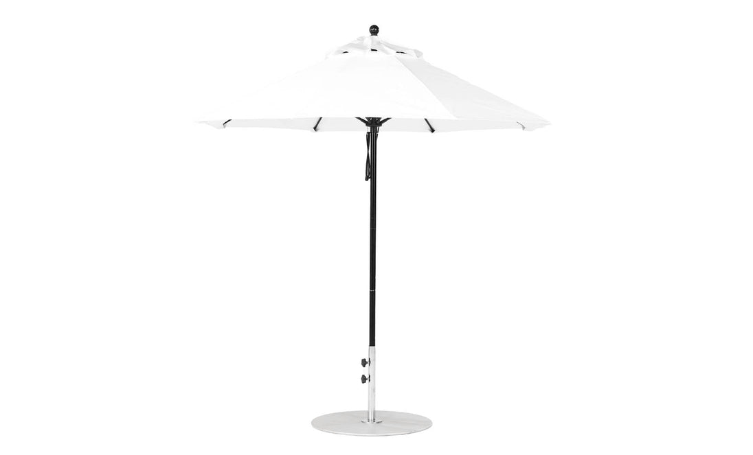 The Essential Fiberglass Umbrella - 7.5 Octagon Pulley by Ledge Lounger features a pointed top, sturdy metal pole, and a round silver base against a white backdrop. It is crafted with marine-grade fabrics for enhanced durability.