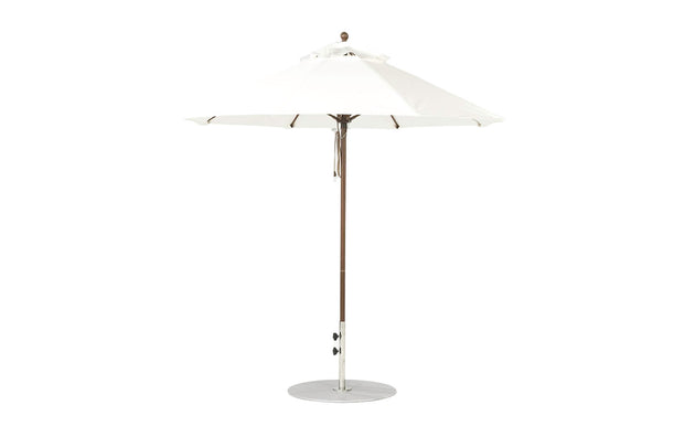 The Ledge Lounger Essential Fiberglass Umbrella - 7.5 Octagon Pulley features a large, white octagonal canopy with eight ribs and a sleek metal pole made from durable marine-grade fabrics, offering wind resistance while standing upright with a circular base against a plain background.