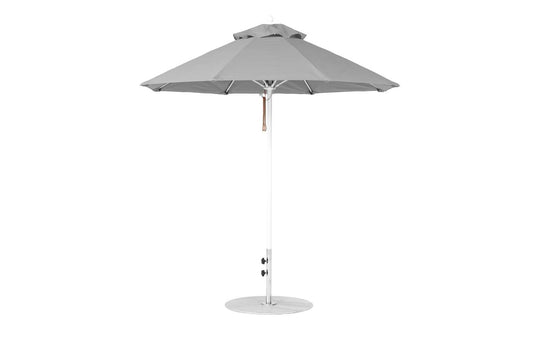 The Ledge Lounger Essential Fiberglass Umbrella features a marine-grade, wind-resistant gray octagon canopy on a slim white pole with a circular base and pulley system for easy operation.