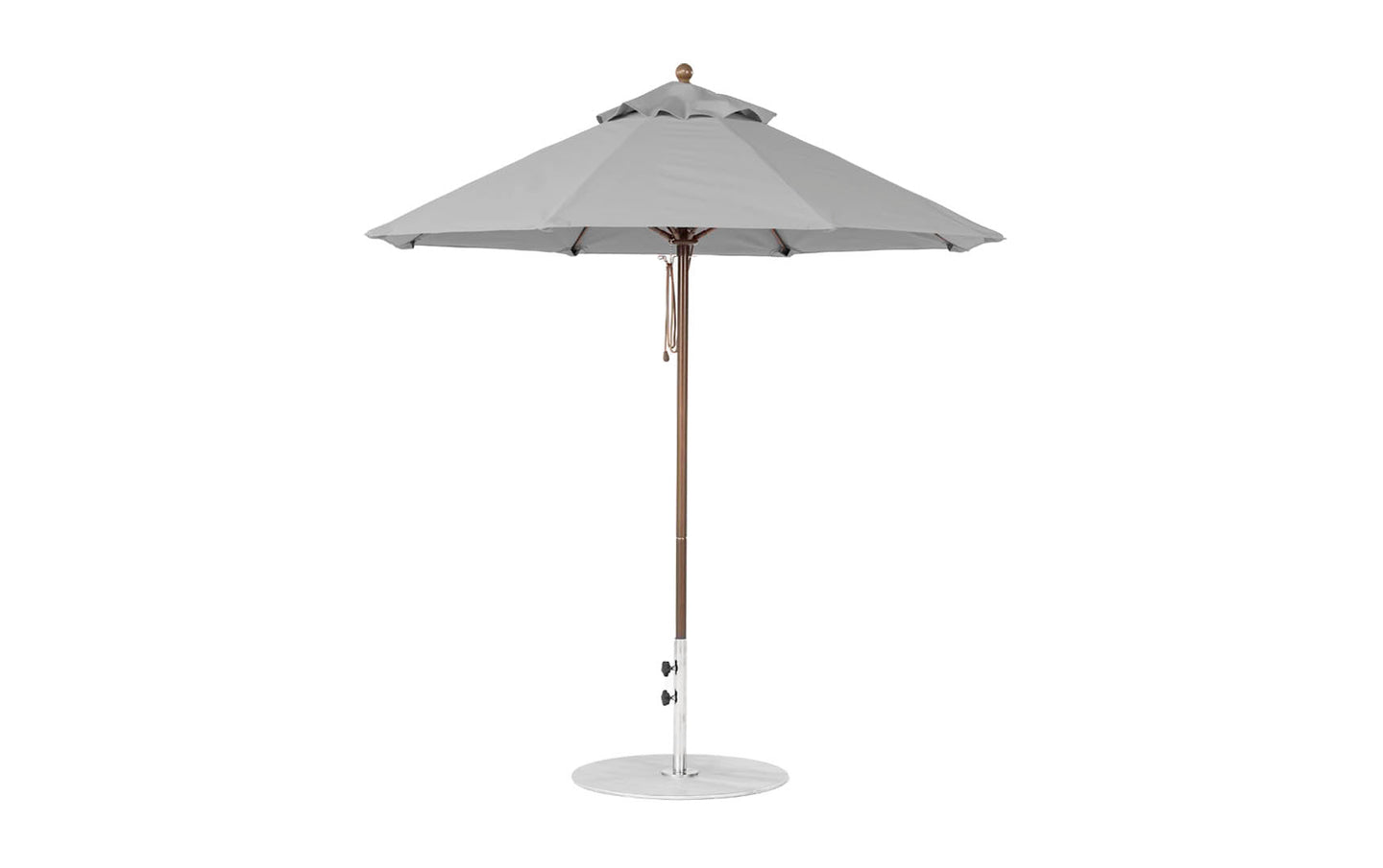 The Ledge Lounger Essential Fiberglass Umbrella features a 7.5 octagonal canopy made from marine-grade fabrics for durability, atop a slender fiberglass pole with a circular base, ideal for garden or patio settings and wind resistance.