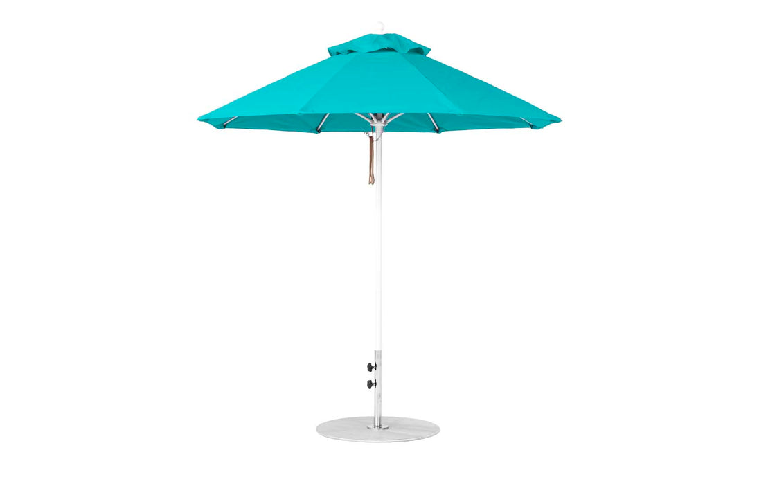 The Ledge Lounger Essential Fiberglass Umbrella features a marine-grade teal canopy with an octagonal shape, adjustable metal pole, and round base. Its wind-resistant design stands tall on a white background, providing durable outdoor use.