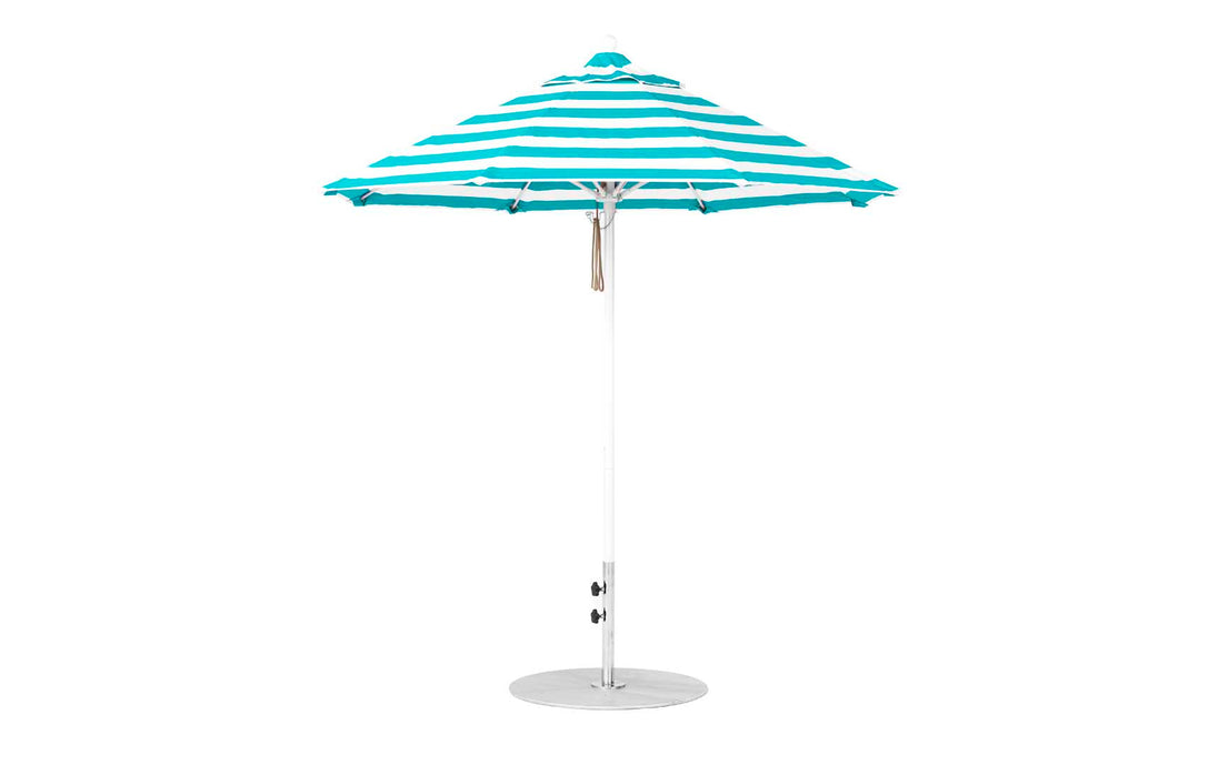 The Essential Fiberglass Umbrella - 7.5 Octagon Pulley by Ledge Lounger features a turquoise and white striped canopy made of marine-grade fabrics and a sturdy metal pole. Its wind-resistant design and round base ensure stability against any seaside breeze, standing open against a plain white background.