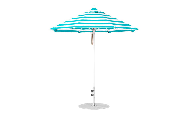 The Essential Fiberglass Umbrella - 7.5 Octagon Pulley by Ledge Lounger features a turquoise and white striped canopy made of marine-grade fabrics and a sturdy metal pole. Its wind-resistant design and round base ensure stability against any seaside breeze, standing open against a plain white background.