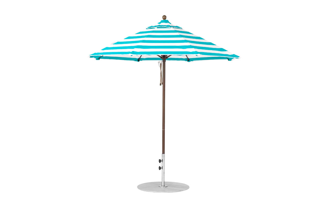 The Ledge Lounger Essential Fiberglass Umbrella features a 7.5 octagon canopy in teal and white stripes, crafted from marine-grade fabric with a slim metal pole and sturdy circular base for wind-resistant shade on any patio.