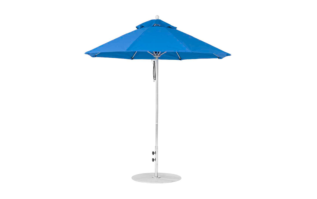 The Ledge Lounger Essential Fiberglass Umbrella features a 7.5 octagon canopy, metal pole, and base, crafted from marine-grade fabrics for durability. With its traditional design, it stands elegantly against a white background.