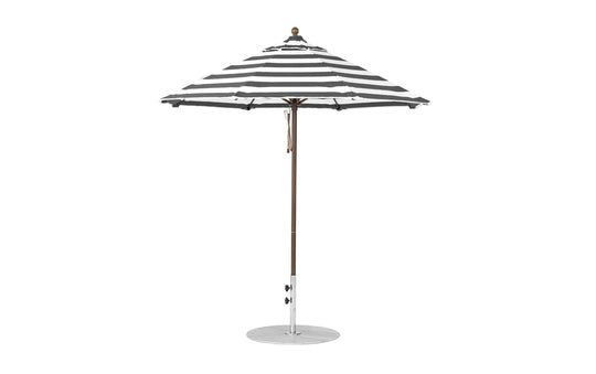 The Essential Fiberglass Umbrella by Ledge Lounger features black and white stripes, a wind-resistant marine-grade fabric, an octagonal shape with a central pole and round base. The 7.5 outdoor umbrella is open against a plain white background.