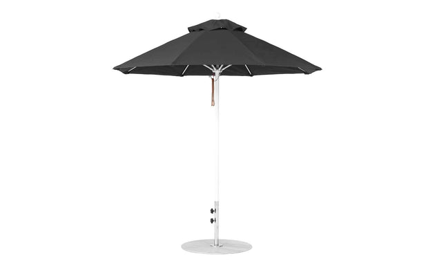 The 7.5 octagon black Essential Fiberglass Umbrella by Ledge Lounger features a silver pole, round base, and marine-grade fabric. Fully opened, its sleek design enhances any garden or patio setting.