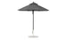 A freestanding, minimalist outdoor umbrella with a metal pole and round base is open, revealing its wide canopy. The wind-resistant Essential Fiberglass Umbrella by Ledge Lounger features marine-grade fabrics for durability and comes in a 7.5 octagon shape.