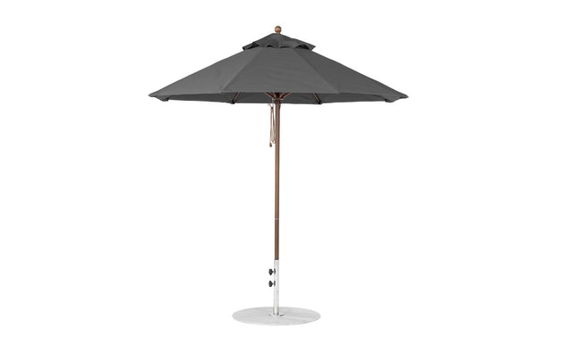 The Essential Fiberglass Umbrella - 7.5 Octagon Pulley by Ledge Lounger features a marine-grade fabric canopy and wooden pole on a white background, showcasing a classic design with a metal base for both durability and elegance.