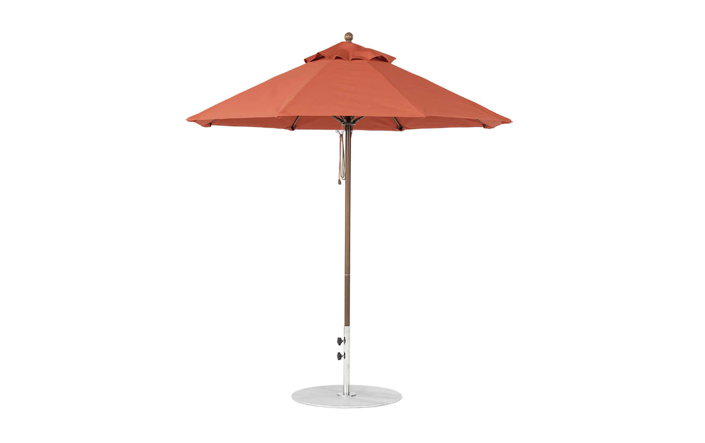 The Essential Fiberglass Umbrella - 7.5 Octagon Pulley by Ledge Lounger is a red outdoor umbrella with marine-grade fabrics for durability, featuring an octagonal canopy supported by a silver pole on a circular base. Its wind-resistant design includes a vented top for airflow against a pristine white background.