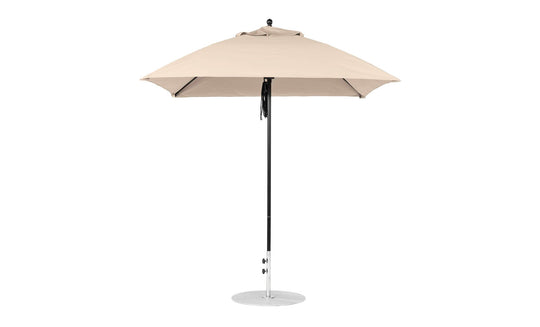 The Ledge Lounger Essential Fiberglass Umbrella, a 7.5 square pulley model in beige, features marine-grade fabrics on a silver pole with a circular base. Its robust design ensures durability and elegance, seen fully open against a plain white background.