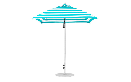 The Essential Fiberglass Umbrella by Ledge Lounger is a teal and white striped, 7.5 square design featuring a pointed top and slender pole. Crafted from marine-grade fabrics, it stands upright on a flat, round metal base for excellent durability.
