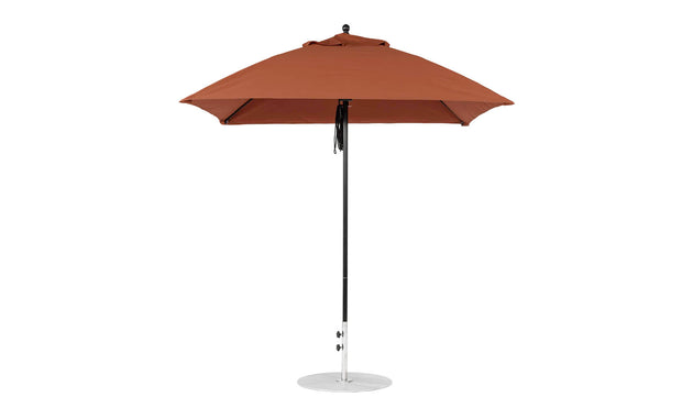 The Essential Fiberglass Umbrella by Ledge Lounger features a tall brown design with a metal pole and round base, showcasing its smooth marine-grade fabric for durability and style in any outdoor setting.