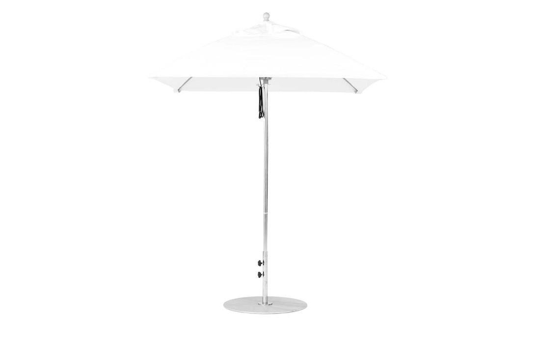 The Essential Fiberglass Umbrella by Ledge Lounger is a 6.5 square, modern outdoor umbrella with a minimalistic design. It features marine-grade fabrics, an aluminum center pole, and a round metal base for sleek support.