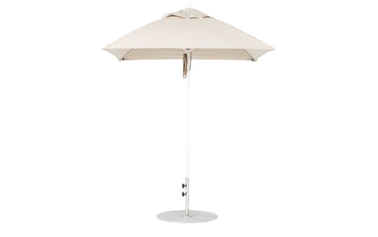 The Ledge Lounger Essential Fiberglass Umbrella - 6.5 Square Pulley features a beige canopy with an aluminum center pole and round metal base. Its minimalist design enhances any outdoor space, while marine-grade fabrics guarantee durability in patios or gardens.