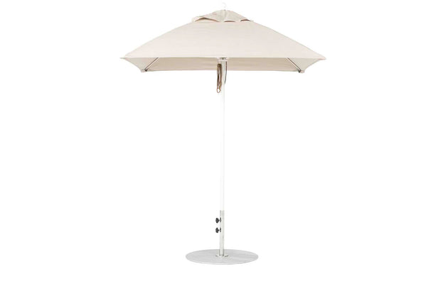 The Ledge Lounger Essential Fiberglass Umbrella - 6.5 Square Pulley features a beige canopy with an aluminum center pole and round metal base. Its minimalist design enhances any outdoor space, while marine-grade fabrics guarantee durability in patios or gardens.