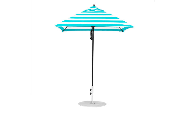 A blue and white striped Ledge Lounger Essential Fiberglass Umbrella, featuring a silver pole and round base made with marine-grade fabrics for durability, is set against a plain white background.