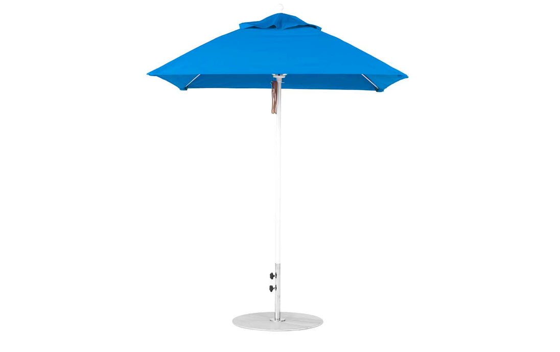The Ledge Lounger Essential Fiberglass Umbrella - 6.5 Square Pulley boasts a marine-grade solid blue fabric canopy, aluminum center pole, and flat round metal base, standing stylishly against a plain white background with its durable design.