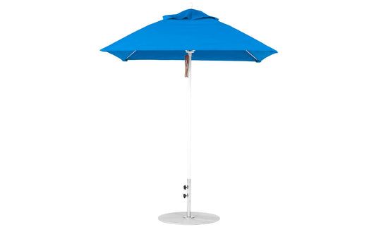 The Ledge Lounger Essential Fiberglass Umbrella - 6.5 Square Pulley boasts a marine-grade solid blue fabric canopy, aluminum center pole, and flat round metal base, standing stylishly against a plain white background with its durable design.
