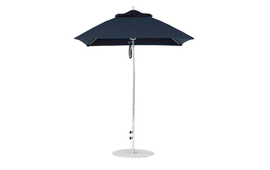 Against a white background, the open Ledge Lounger Essential Fiberglass Umbrella - 6.5 Square Pulley is displayed, featuring a navy blue marine-grade fabric canopy, an aluminum center pole, and a round base, providing ample shade.