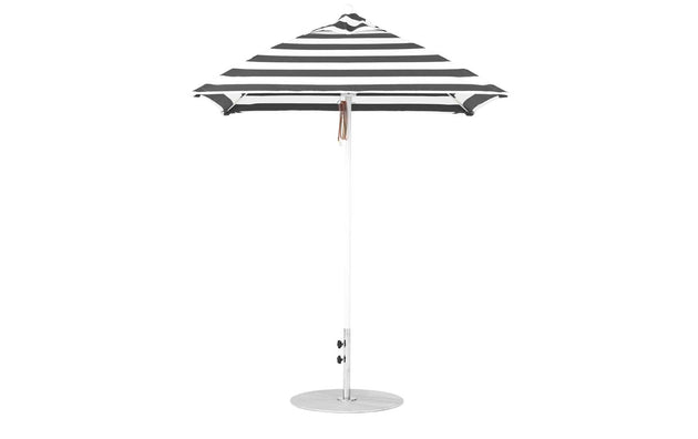 The Ledge Lounger Essential Fiberglass Umbrella - 6.5 Square Pulley features a pointed top and sleek aluminum center pole. The black and white marine-grade fabric bands offer a timeless style, standing upright on a circular base.