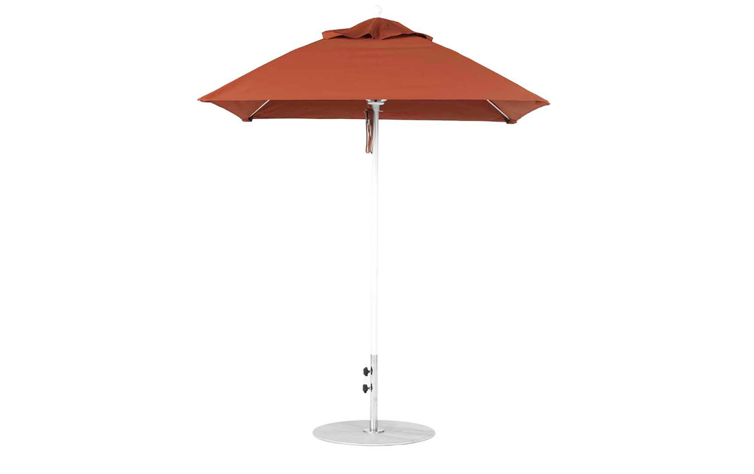The Ledge Lounger Essential Fiberglass Umbrella, 6.5 Square Pulley in brown, boasts a modern design with an aluminum center pole and round base. Made from marine-grade fabrics, its shown closed against a plain white background.