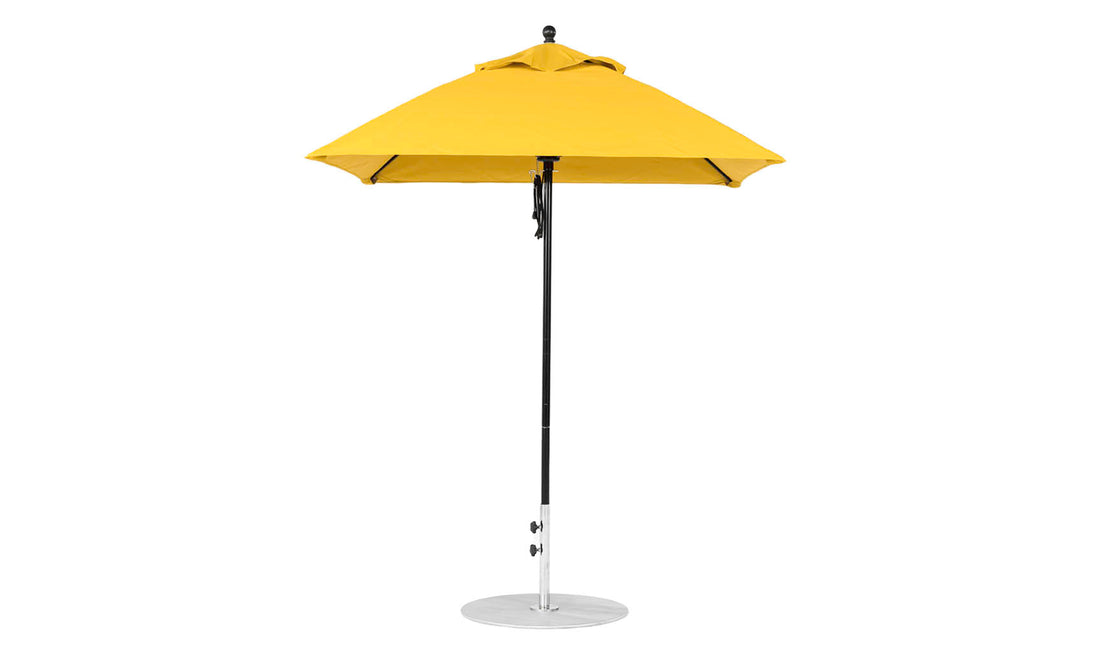 The Essential Fiberglass Umbrella - 6.5 Square Pulley by Ledge Lounger is a yellow patio umbrella with a silver, straight aluminum center pole and round base. It features durable marine-grade fabric and is ideal for outdoor use.