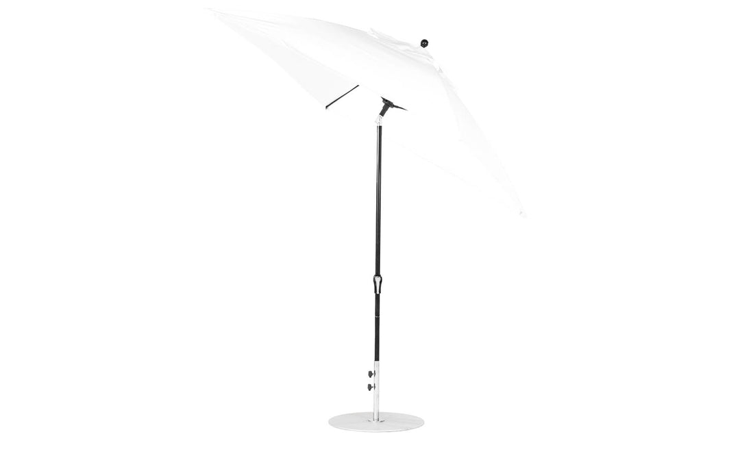 The white Ledge Lounger Essential Fiberglass Umbrella features a sleek metal pole, circular base, and an adjustable auto tilt. Ideal for outdoor use, this 7.5 square umbrella offers shade with corrosion-resistant materials and marine-grade fabrics.