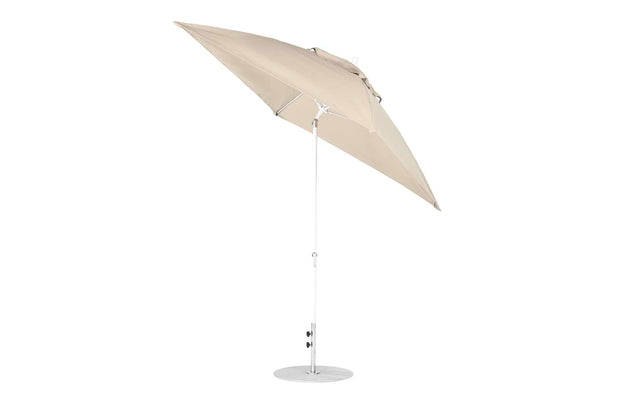 The Ledge Lounger Essential Fiberglass Umbrella - 7.5 Square Crank Auto Tilt features a corrosion-resistant metal pole and round base in beige. Partially open and tilted, it offers angled coverage with marine-grade fabric for lasting shade in any outdoor setting.