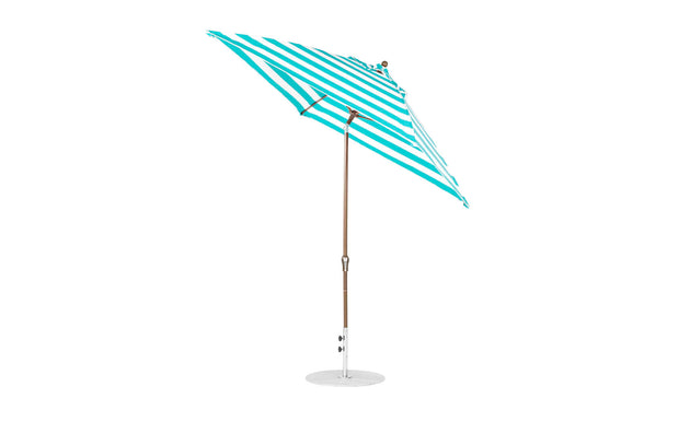 The Ledge Lounger Essential Fiberglass Umbrella - 7.5 Square Crank Auto Tilt showcases a green and white striped canopy crafted from marine-grade fabrics, paired with a wooden pole and corrosion-resistant metal base, offering elegance and durability against a pristine white background.
