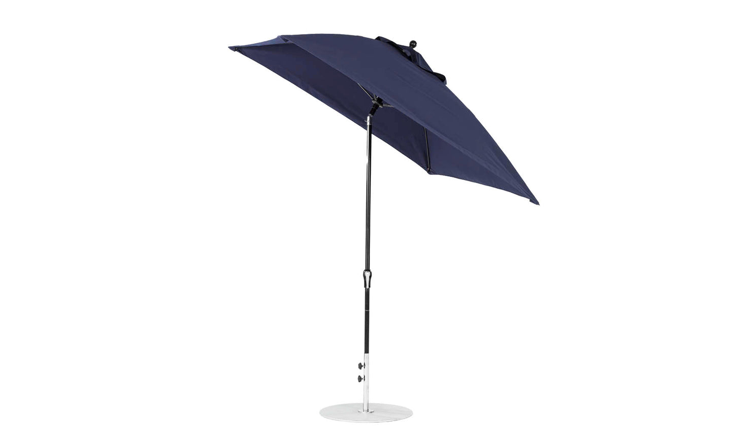 A navy blue Essential Fiberglass Umbrella by Ledge Lounger, in marine-grade fabric with a corrosion-resistant silver pole, elegantly tilted against a white backdrop.
