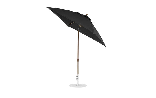 The Ledge Lounger 7.5 Square Crank Auto Tilt Essential Fiberglass Umbrella features a corrosion-resistant round white base, metal pole, and marine-grade fabrics. It is open and angled to showcase its sturdy structure against a plain white background.