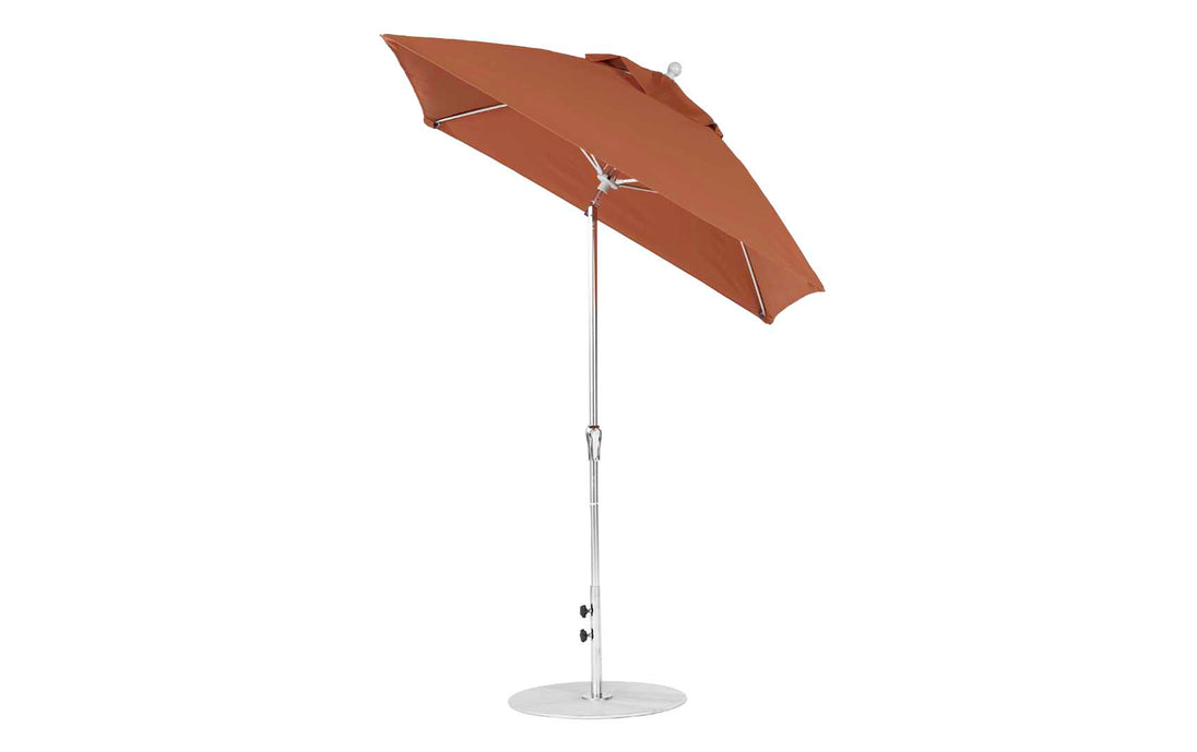 The Ledge Lounger Essential Fiberglass Umbrella - 7.5 Square Crank Auto Tilt features marine-grade fabrics, a brown canopy, and a silver telescopic pole. It is slightly tilted on a round silver base against a plain white background.