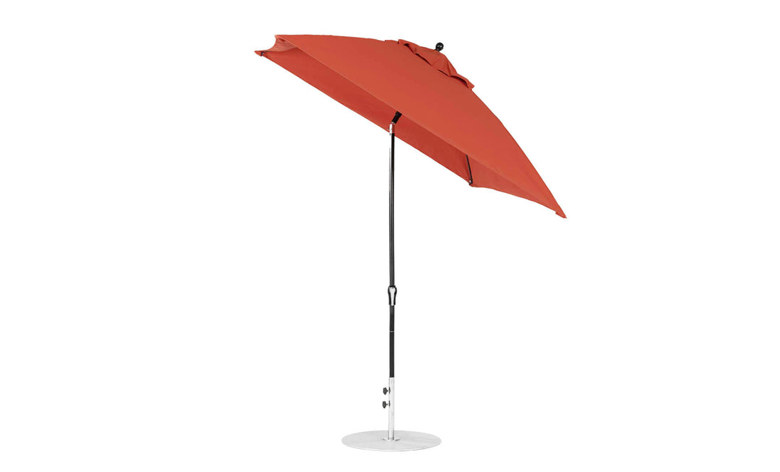 Introducing the Ledge Lounger Essential Fiberglass Umbrella, a 7.5 square red cantilever patio umbrella with marine-grade fabrics and corrosion-resistant metal stand. Its adjustable design elegantly tilts to provide perfect shade wherever you need it.