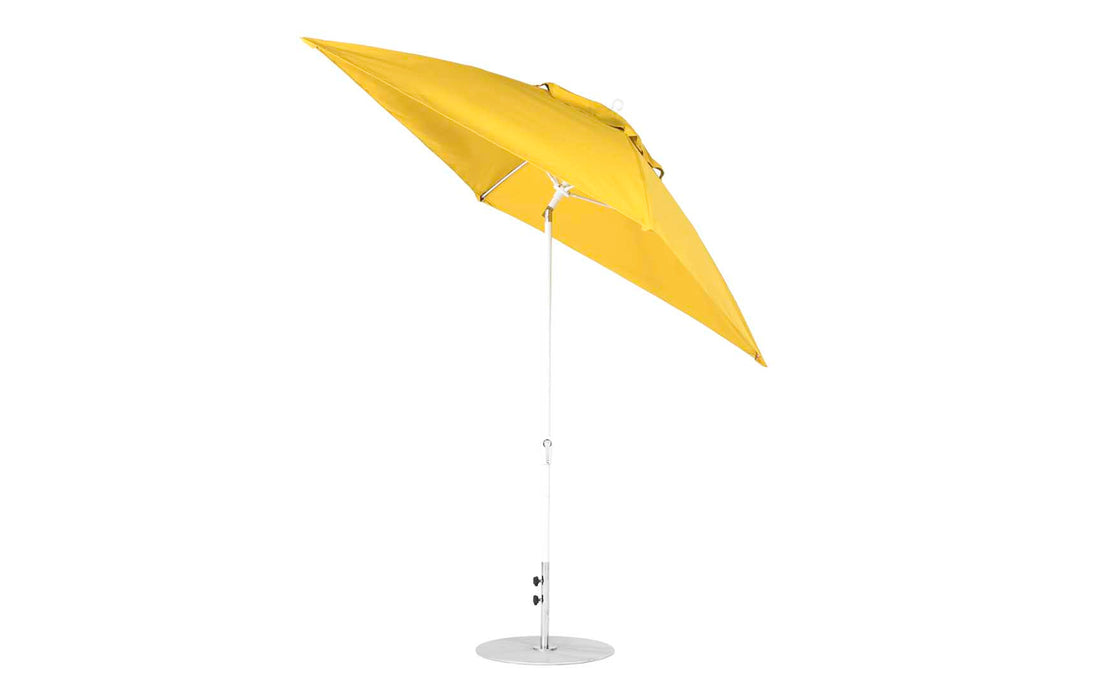 The Ledge Lounger Essential Fiberglass Umbrella - 7.5 Square Crank Auto Tilt, crafted with corrosion-resistant materials and marine-grade fabrics, features a yellow canopy on a white metal pole with tilt mechanism and stands on a circular base against a plain white background.