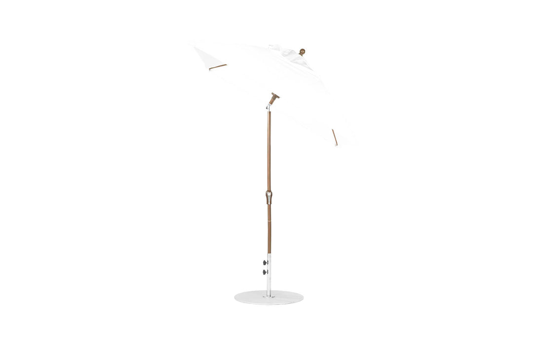 The Essential Fiberglass Umbrella by Ledge Lounger, a 6.5 square model with an auto tilt crank, features a white design with a wooden pole and metal base, crafted from corrosion-resistant materials and durable marine-grade fabrics, showcased against a plain white background.