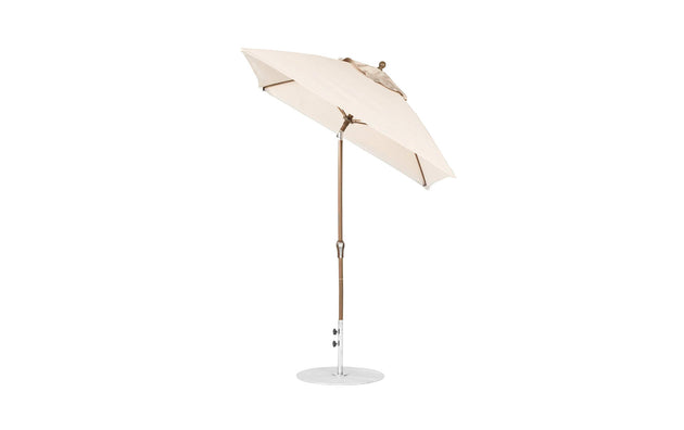 The Ledge Lounger Essential Fiberglass Umbrella - 6.5 features marine-grade fabrics, a wooden pole, a circular metal base, and a tilt function.