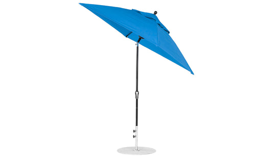 The Ledge Lounger Essential Fiberglass Umbrella, a 6.5 square model with a corrosion-resistant metal pole and circular base, is open and tilted. It is made from marine-grade fabrics and features a crank handle for easy adjustment against a white background.