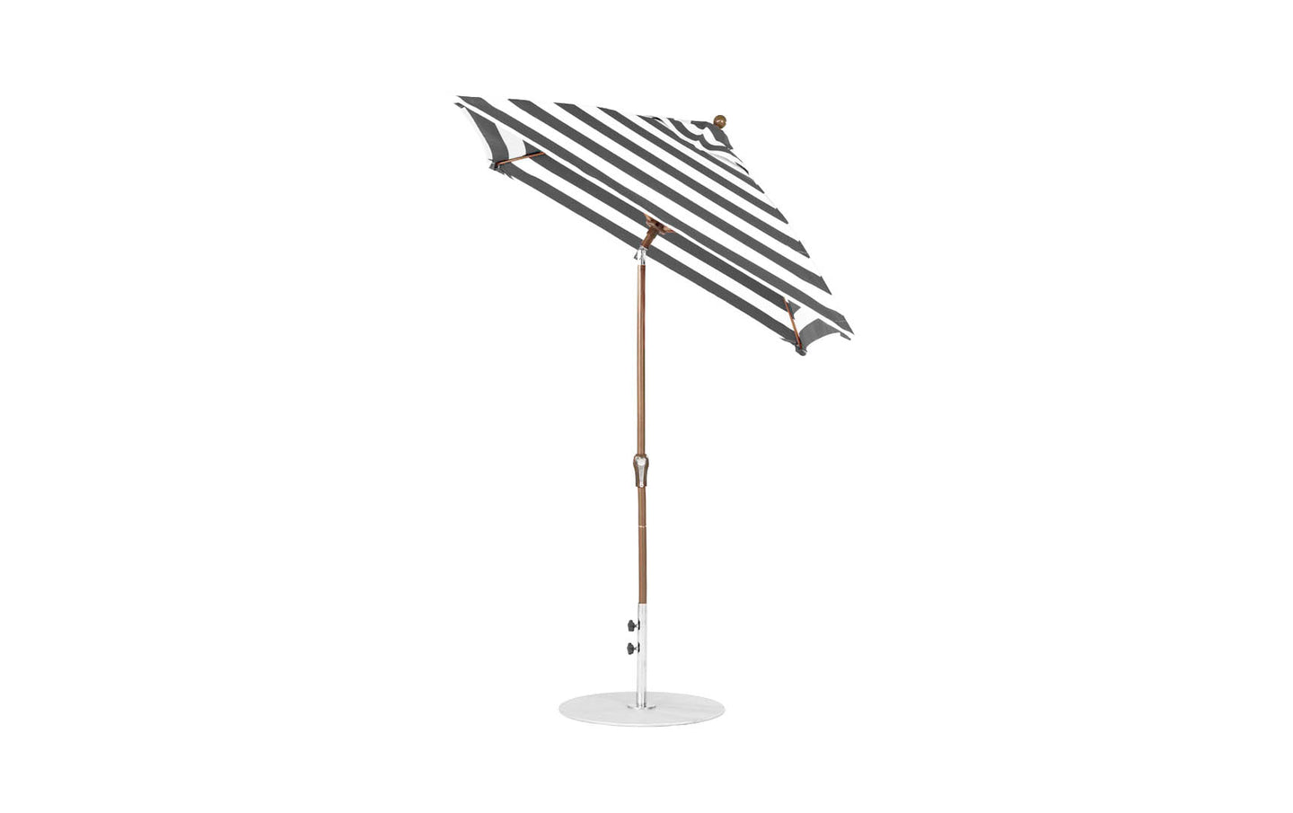 The Essential Fiberglass Umbrella by Ledge Lounger is a sleek, modern outdoor umbrella featuring marine-grade fabrics in black and white stripes. Its wooden pole and circular base ensure stability, while the 6.5 square crank auto-tilt design provides durable shading for outdoor settings.