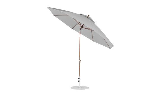 The Ledge Lounger Essential Fiberglass Umbrella features an 11 octagon canopy in gray, made from marine-grade fabric. It has a fiberglass pole with a round, corrosion-resistant base and a simple modern design. The umbrella is fully open with a slight tilt for ample shade.