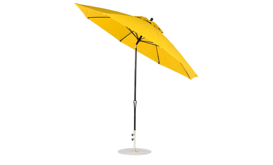 A vibrant yellow Ledge Lounger Essential Fiberglass Umbrella with a sleek black pole and round silver base is tilted open, featuring marine-grade fabrics to highlight style and durability against a plain white background.