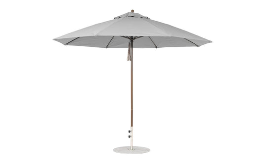 The Ledge Lounger Essential Fiberglass Umbrella - 11 Octagon Pulley features a round canopy with a central pole on a circular base. Made from marine-grade fabrics, this wind-resistant umbrella provides ample shade and its simple, modern design suits any outdoor setting.