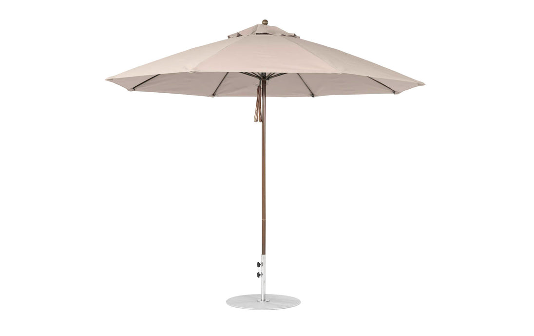 The Ledge Lounger Essential Fiberglass Umbrella features an 11 octagon canopy in marine-grade fabric, a slender metal pole, and a circular base, perfect for providing shade outdoors.